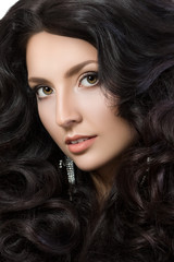 Fototapeta premium Close-up portrait of elegant woman with beautiful black hair. Beauty girl with perfect skin. Face make-up. Beauty, spa and hair care concept