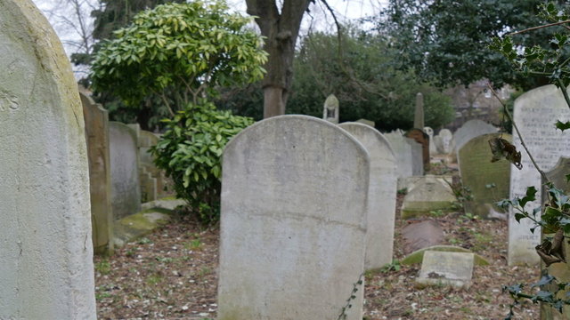 Gravestones in an old cemetery in London. In this cemetery lies the dead bodies of the late people in London