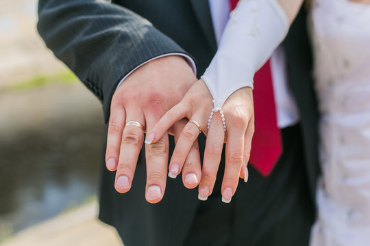 Hands of the bride and groom.