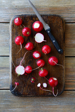 fresh radishes on a cutting board