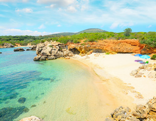 parasols in a small beach in Alghero