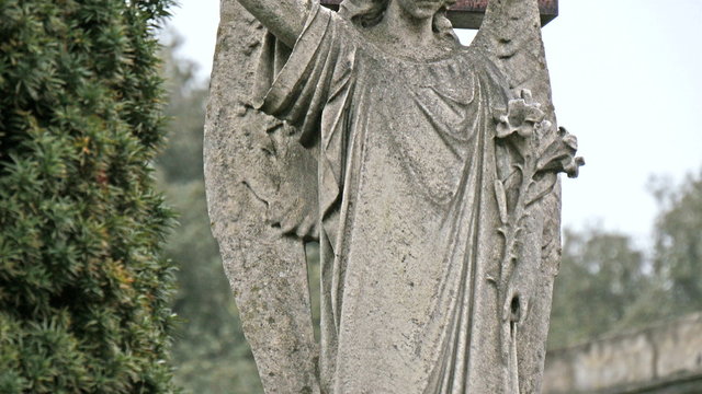 A statue of a lady angel in the cemetery. It is one of the many statues found inside the cemetery