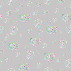 Seamless pattern of hearts and circles formed from the watercolor floral elements on a grey background