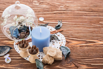 spa stuff on wooden background: candle, aroma
