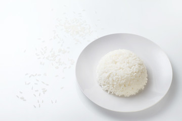 Fototapeta na wymiar Rice on white plate isolated on white background