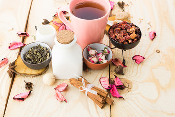 Tea cups with teapot on old wooden table