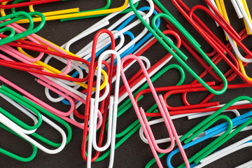 Paper clips on a black background