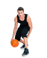 Portrait of a handsome man playing in basketball