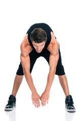 Full length portrait of a fitness man stretching