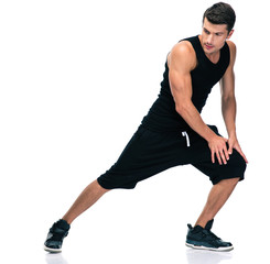 Fitness man stretching legs