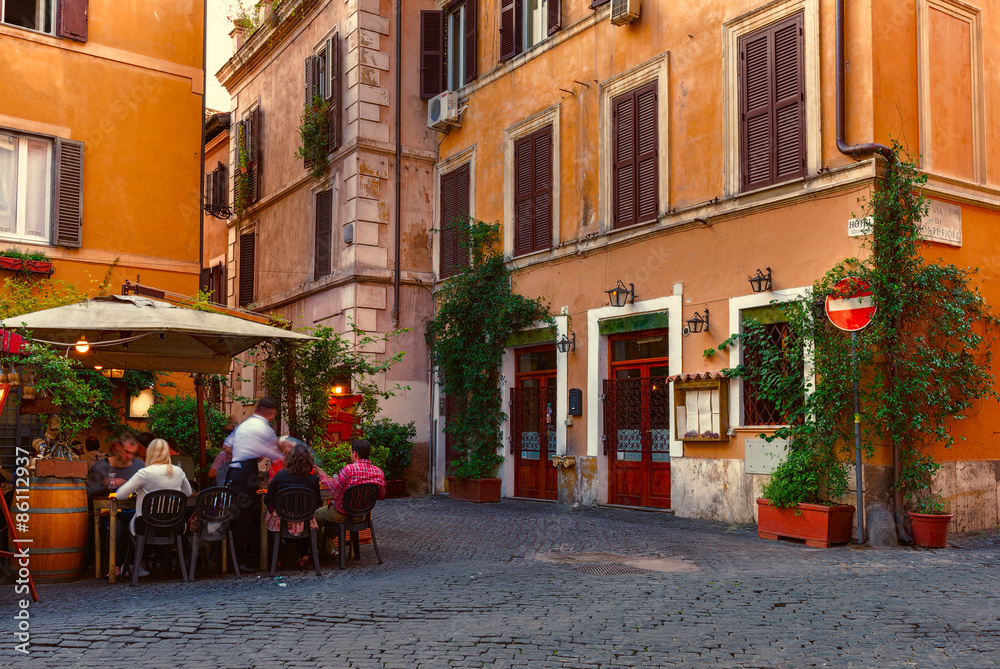 Wall mural old street in trastevere in rome, italy