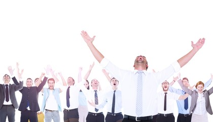 Composite image of handsome businessman cheering with arms up