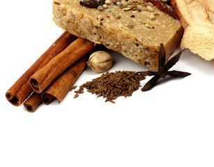 handmade soap with cinnamon and anise star on white background