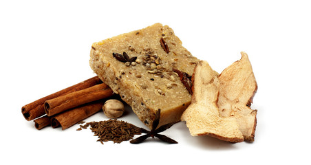handmade soap with cinnamon and anise star on white background