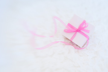 A gift box on a white cloth background