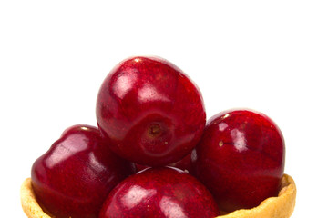 a bunch of ripe cherries in tartlet