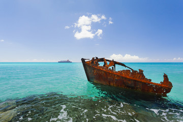 Image of a rusted piece of boat in the beach