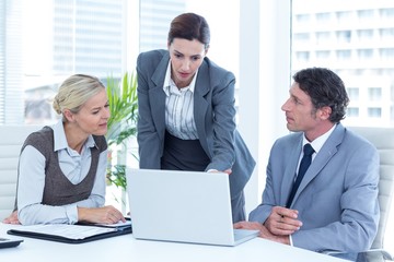 Business people using laptop