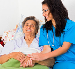 Obraz premium Kind Nurse with Elderly