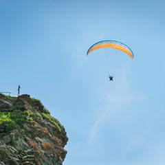Fototapeta na wymiar Couple on a parachute