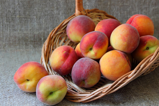 Basket with ripe peaches.