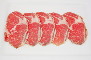 High grade sliced Hida wagyu beef isolated on white background