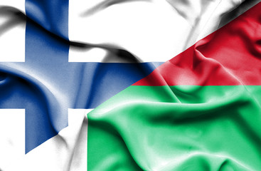 Obraz premium Waving flag of Madagascar and Finland