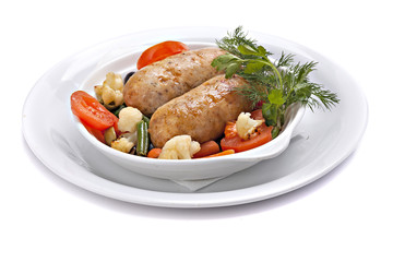 Baked sausage with vegetables  in bowl