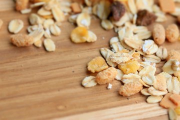 Oat flakes on a wooden background