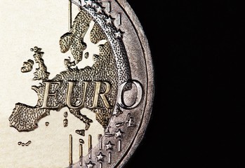Euro coin on black background