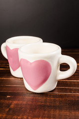 two coffee cup on wooden background