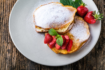 filled with homemade pancakes with strawberries