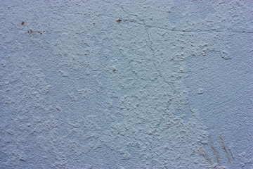Textured walls with dirt.