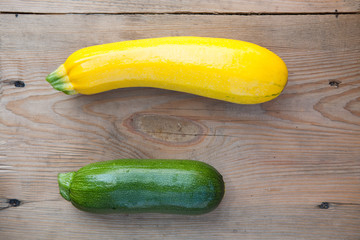 organic  zucchini on wooden background, top view