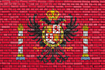 flag of Toledo painted on brick wall