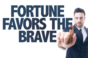 Business man pointing the text: Fortune Favors the Brave