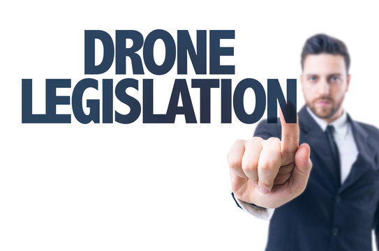 Business man pointing the text: Drone Legislation