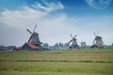 Naklejka premium Traditional Dutch windmills with canal near the Amsterdam
