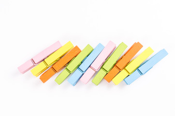 Group of colorful wooden clothespins isolated on white backgroun