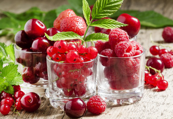 Assorted summer berries: raspberries, red currant, cherry, straw