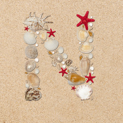 Fototapeta na wymiar N - letter arranged from sea shells and starfishes