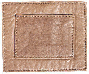 Blank leather label with stitches. Background texture.