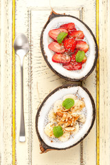 Chia seeds pudding dessert with banana and strawberries