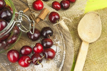 Domestic production of cherry jam. Freshly picked cherries ready for canning. The supply of fruits for the winter and a rainy day. The preparation of sweets for the family.
