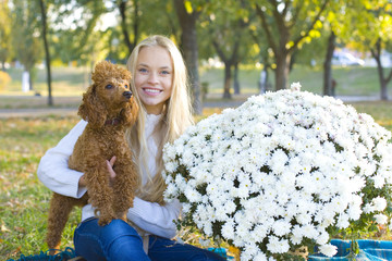 teen girl and her red poodle