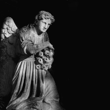sculpture of an angel in black and white colors