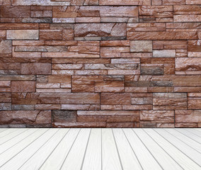 room interior with brick wall and white wood floo