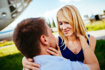 Happy Smiling Couple Relaxing on Green Grass.Park.