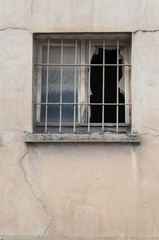 window broken at an industrial building facade