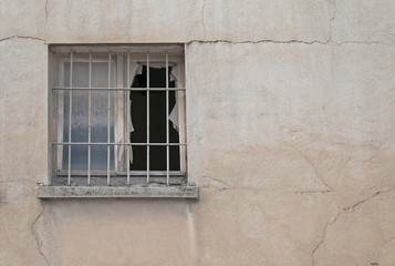 Fototapeta na wymiar window broken at an industrial building facade